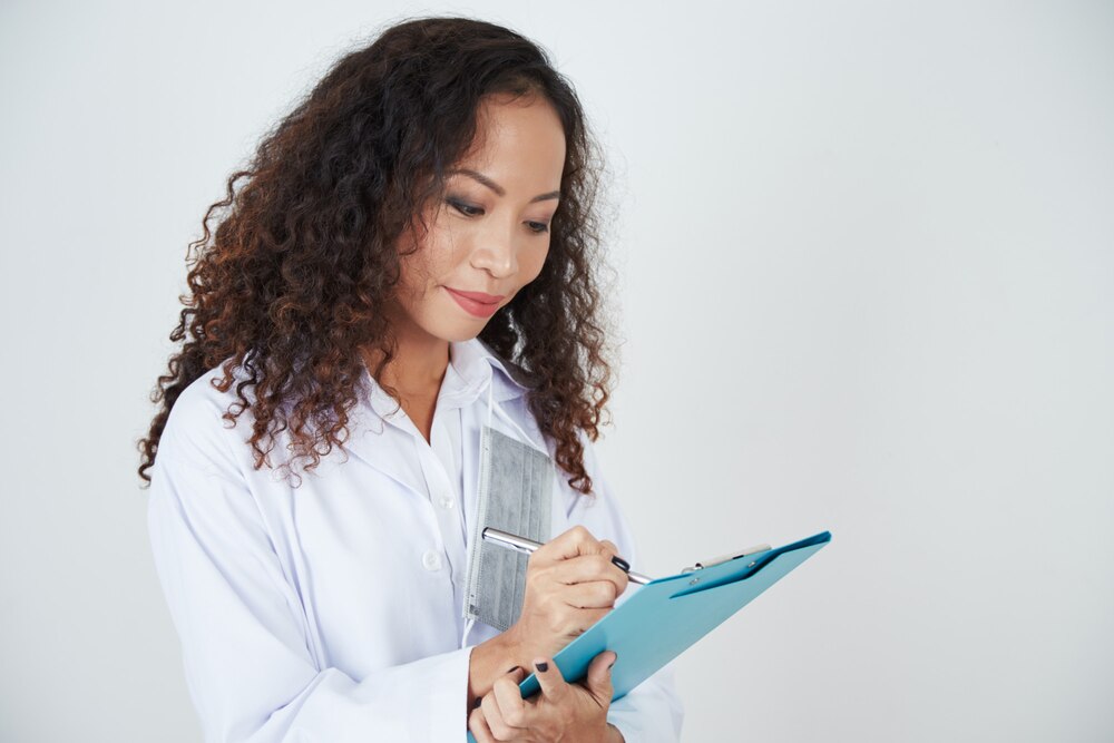 Doctor writing a treatment