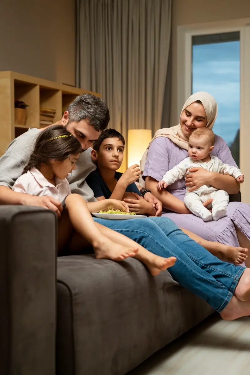 Full shot islamic family on couch